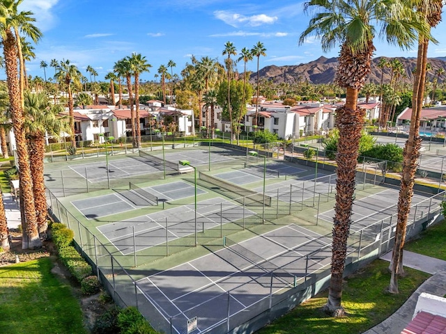 view of tennis court featuring a mountain view