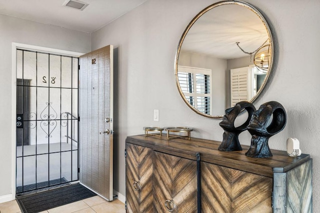 foyer entrance with light tile patterned floors