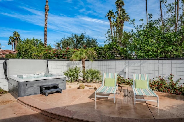 view of patio featuring a hot tub