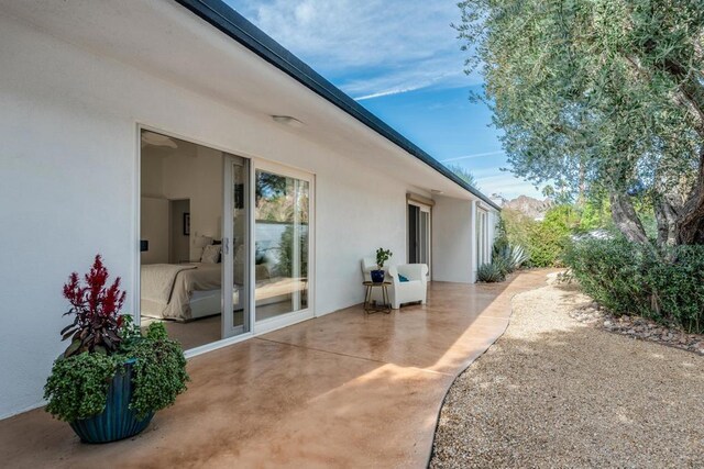 view of side of home featuring a patio area