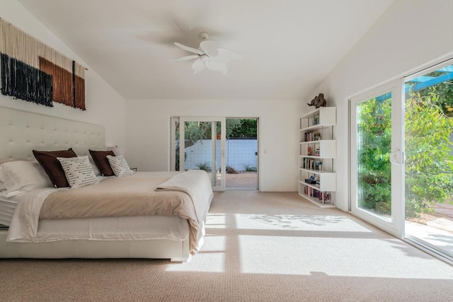 bedroom with ceiling fan, access to exterior, light carpet, and vaulted ceiling