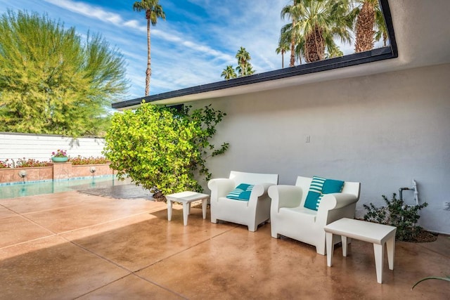 view of patio featuring a fenced in pool