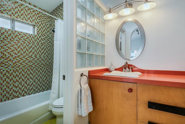 full bathroom featuring vanity, toilet, and shower / bath combo with shower curtain