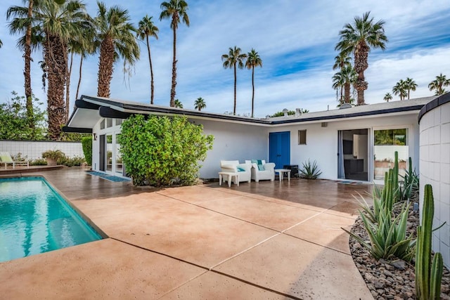 view of swimming pool with a patio