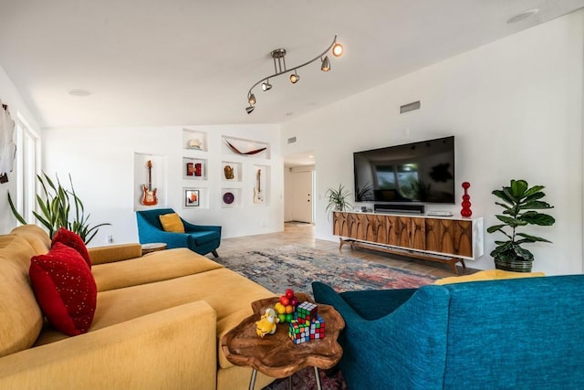 living room featuring lofted ceiling