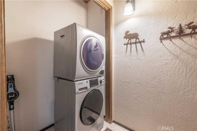 washroom with stacked washer and clothes dryer