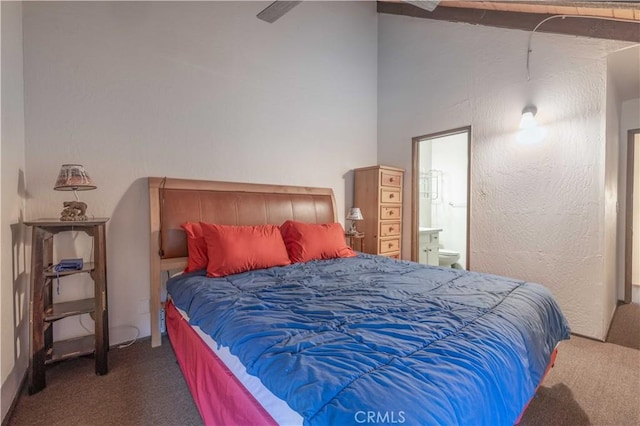 bedroom featuring connected bathroom, ceiling fan, and carpet floors