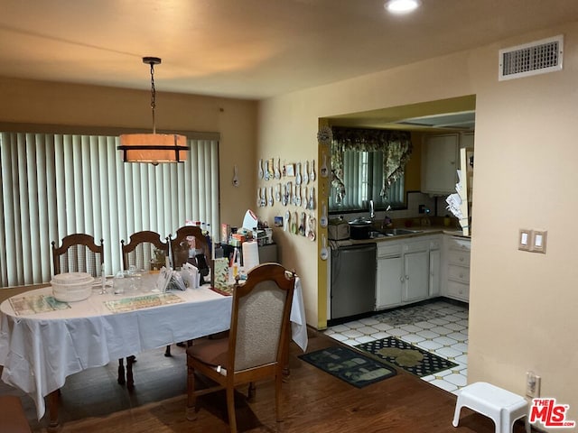 dining area featuring light hardwood / wood-style floors and sink