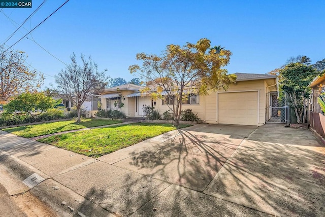 ranch-style home with a garage and a front yard