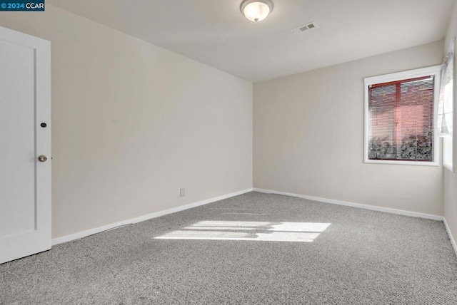 unfurnished room featuring carpet flooring