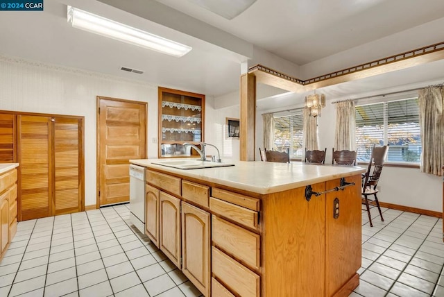 kitchen with light tile patterned flooring, a center island with sink, dishwasher, and sink