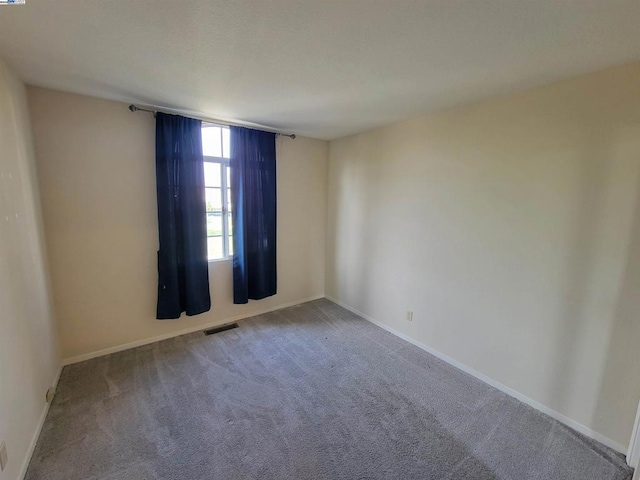 empty room featuring carpet flooring