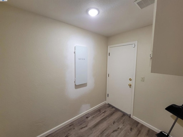 doorway to outside with light hardwood / wood-style floors