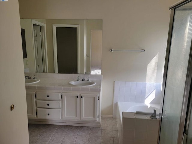 bathroom featuring tile patterned floors, vanity, and independent shower and bath