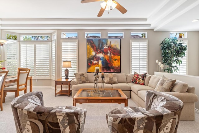 carpeted living room featuring ceiling fan