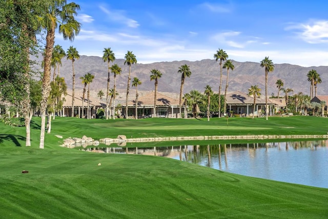 view of home's community featuring a lawn and a water and mountain view