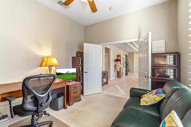 office featuring ceiling fan and light colored carpet