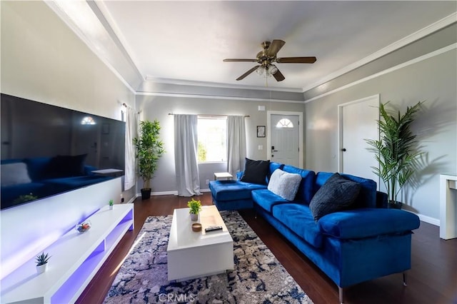 living room with dark hardwood / wood-style floors, ceiling fan, and crown molding