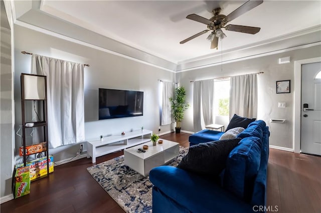 living room featuring ceiling fan and dark wood-type flooring