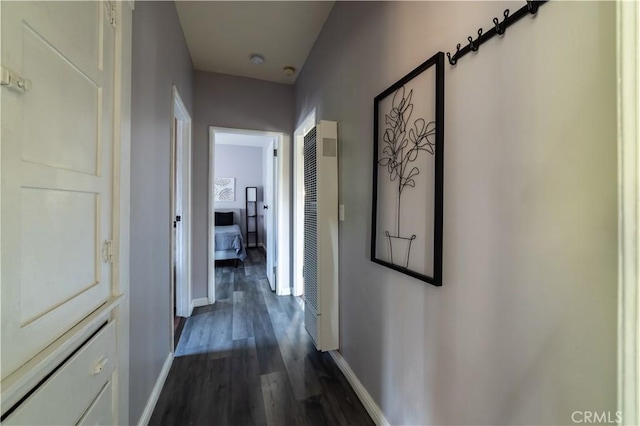 corridor featuring dark wood-type flooring