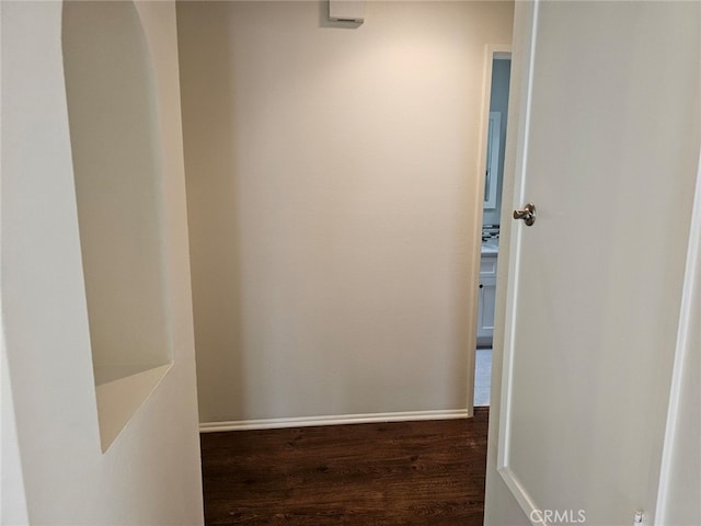 hallway featuring dark wood-type flooring