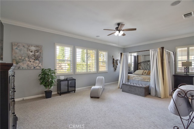 bedroom with ceiling fan, crown molding, and light carpet