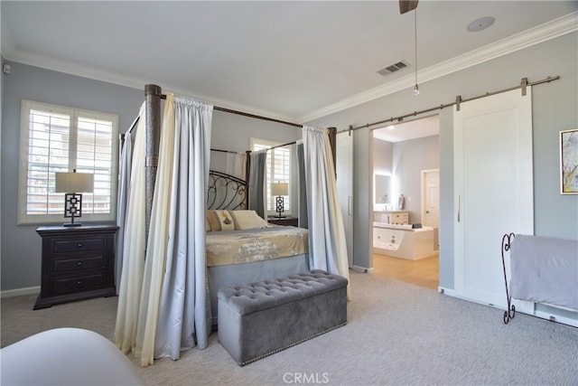 carpeted bedroom featuring ceiling fan, a barn door, ornamental molding, and connected bathroom