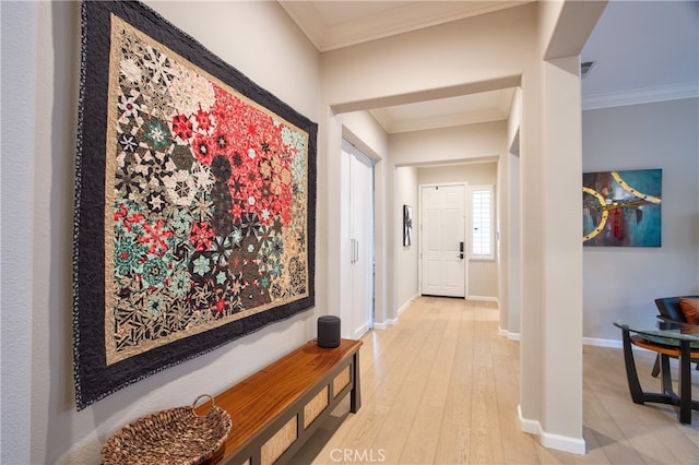 hall featuring hardwood / wood-style floors and ornamental molding