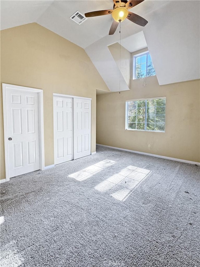 additional living space with ceiling fan, vaulted ceiling, and carpet