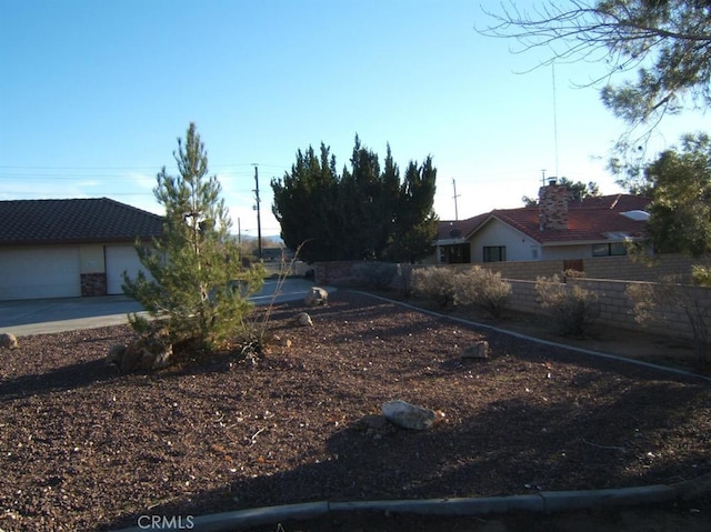 view of yard with a garage