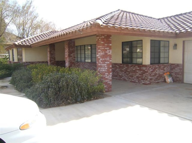 view of side of property featuring a garage