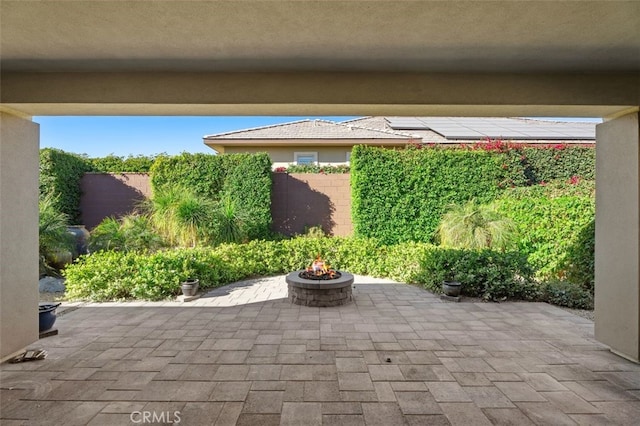 view of patio / terrace with an outdoor fire pit