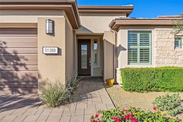 property entrance with a garage