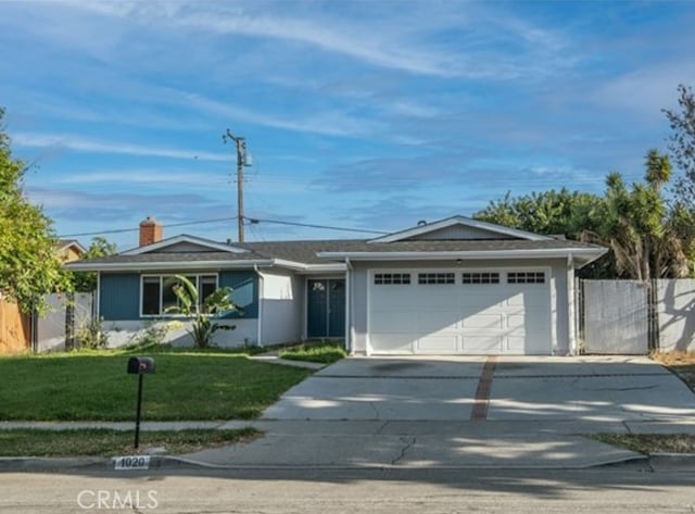 ranch-style house with a garage and a front yard