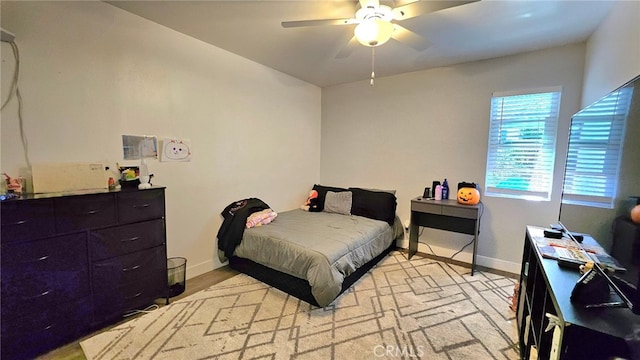 bedroom featuring light wood-type flooring and ceiling fan