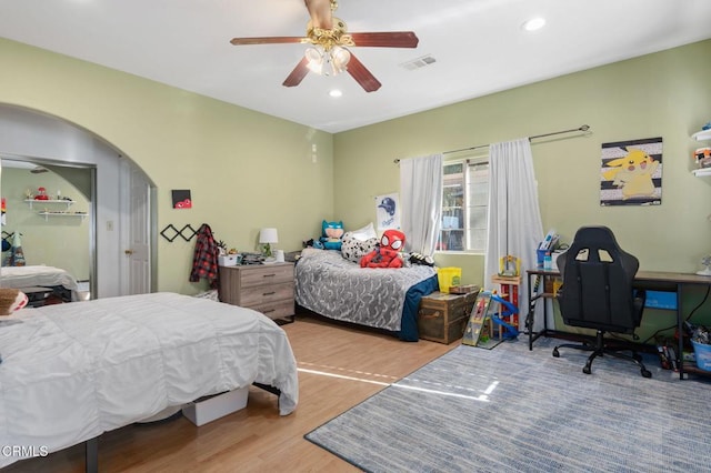 bedroom featuring ceiling fan and hardwood / wood-style flooring