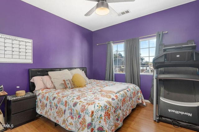 bedroom featuring ceiling fan and hardwood / wood-style floors