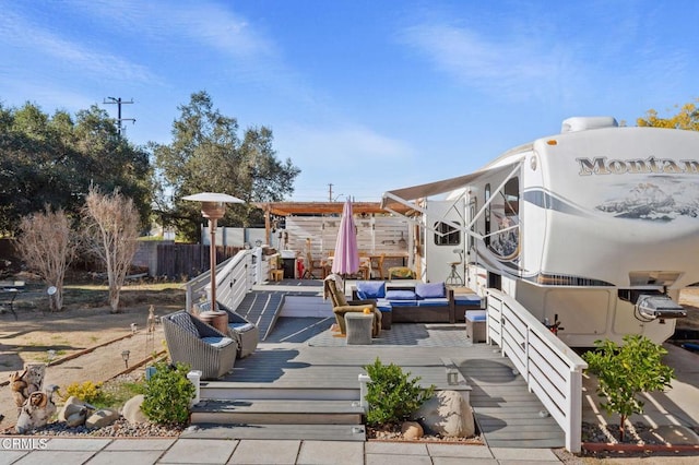 view of patio with an outdoor hangout area and a deck