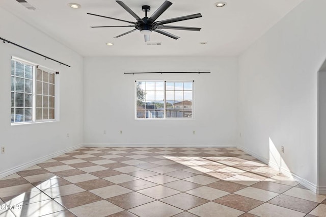 empty room with ceiling fan, baseboards, visible vents, and recessed lighting