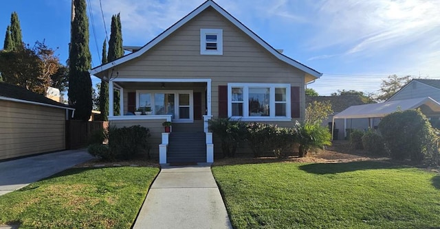 bungalow-style house with a front lawn