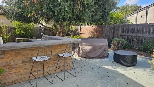 view of patio featuring a bar