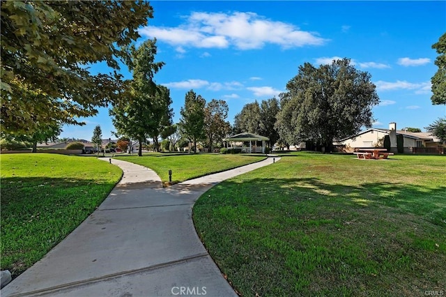 view of property's community featuring a gazebo and a lawn