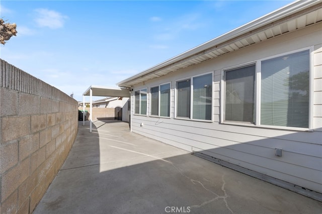 view of side of home with a patio