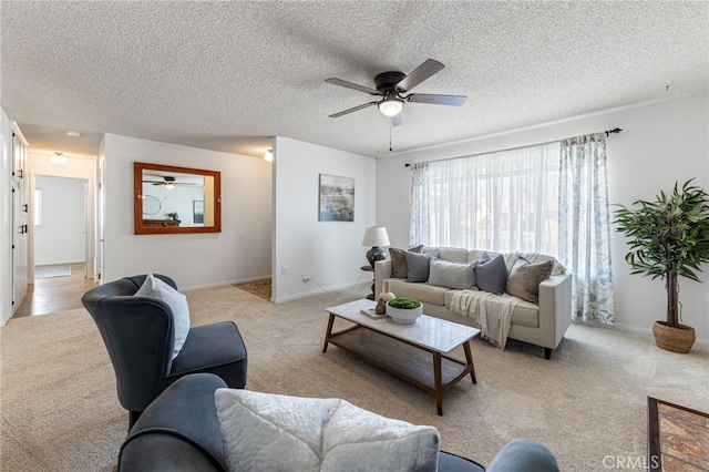 carpeted living room with a textured ceiling and ceiling fan