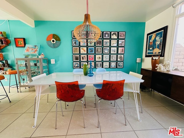 dining room featuring light tile patterned floors and a chandelier