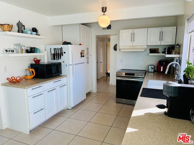 kitchen with sink, light tile patterned floors, white fridge, electric stove, and white cabinets