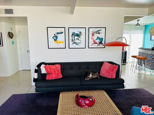 living room with ceiling fan and beam ceiling