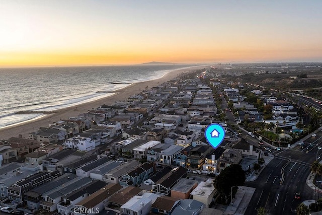 aerial view featuring a water view and a beach view