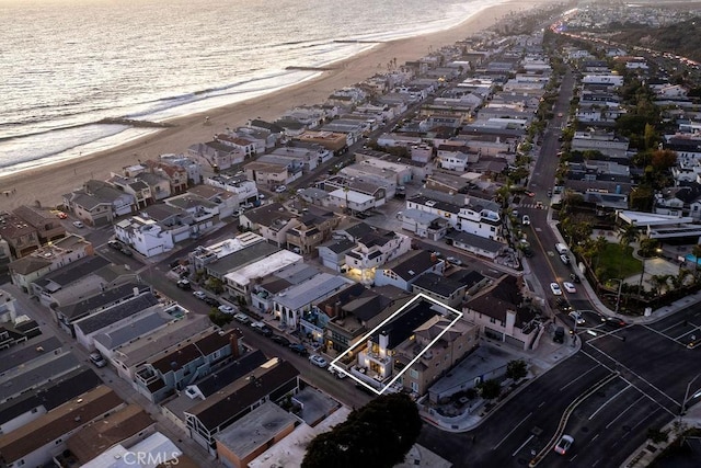 bird's eye view with a residential view, a beach view, and a water view