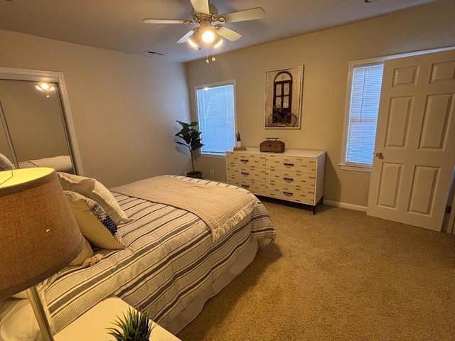 carpeted bedroom featuring ceiling fan